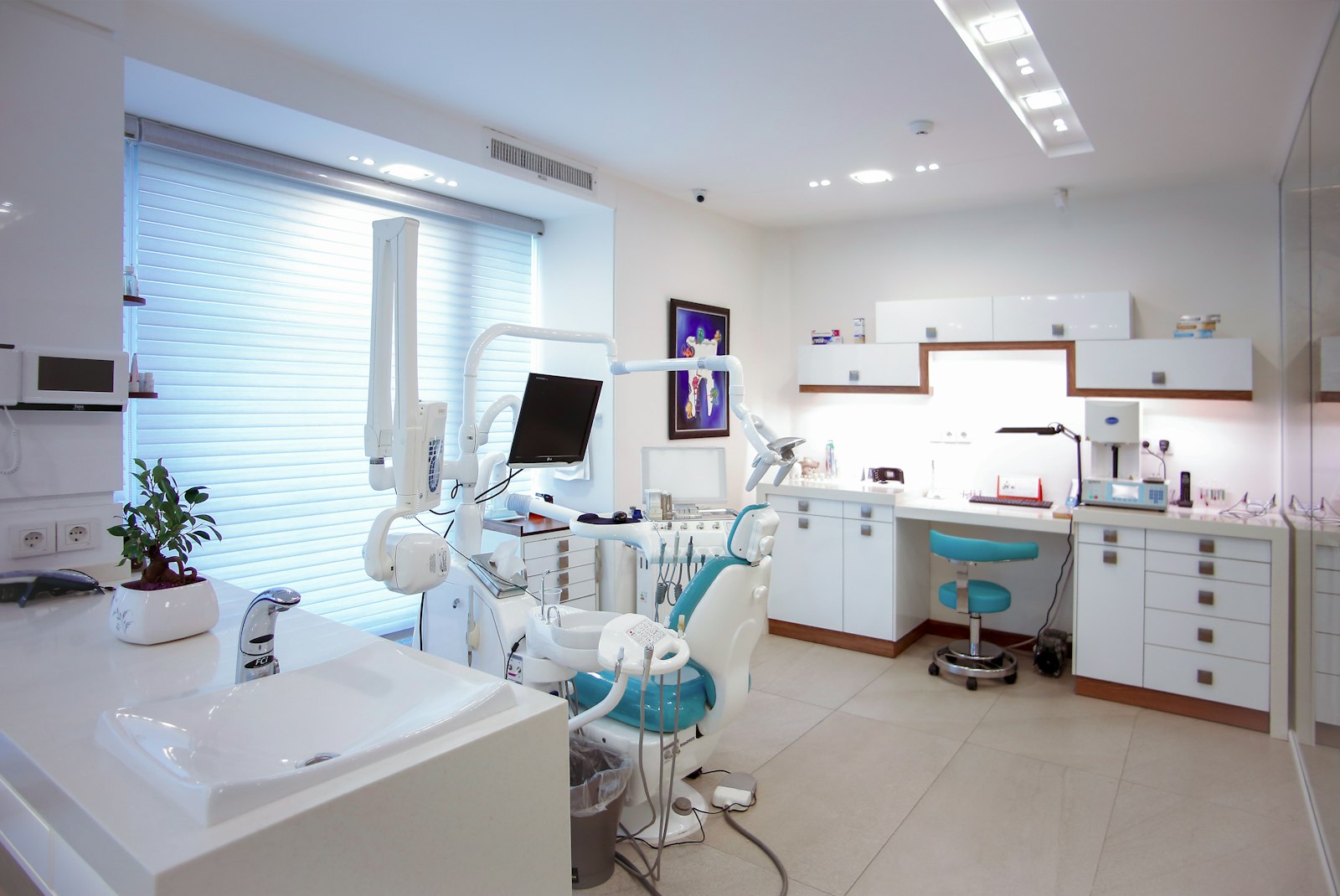 A modern dental chair in a sunlit treatment room